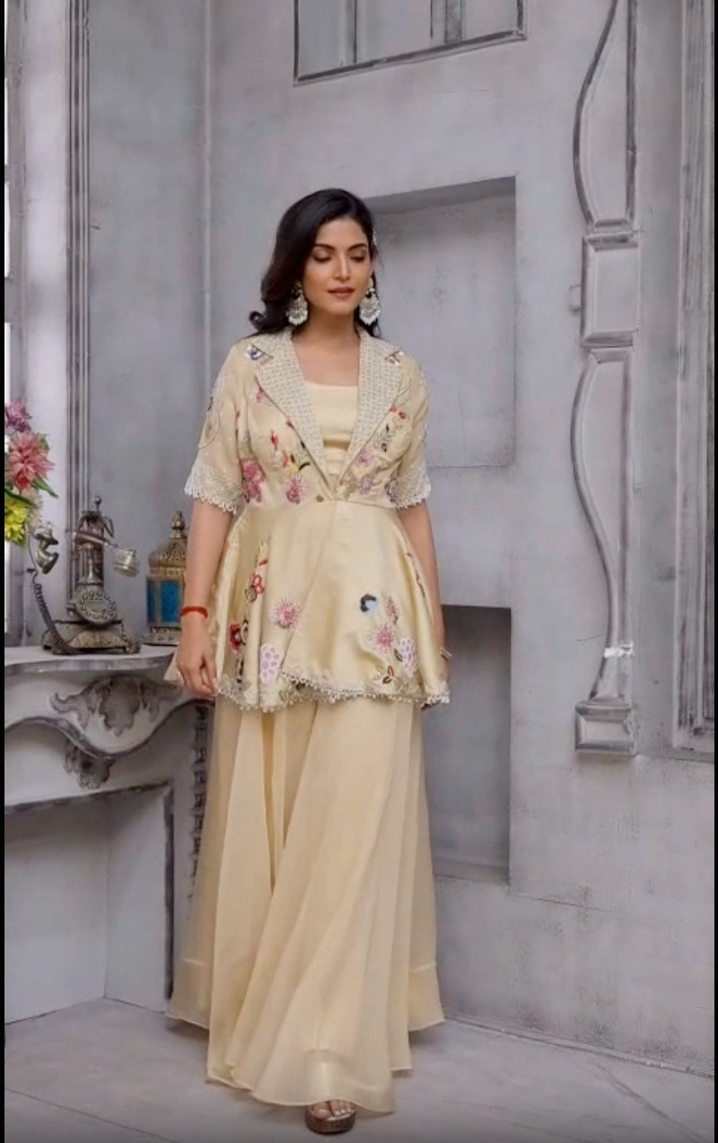 Beige color peplum with it gazal gupta culture hand work touch on it with pure crape palazo